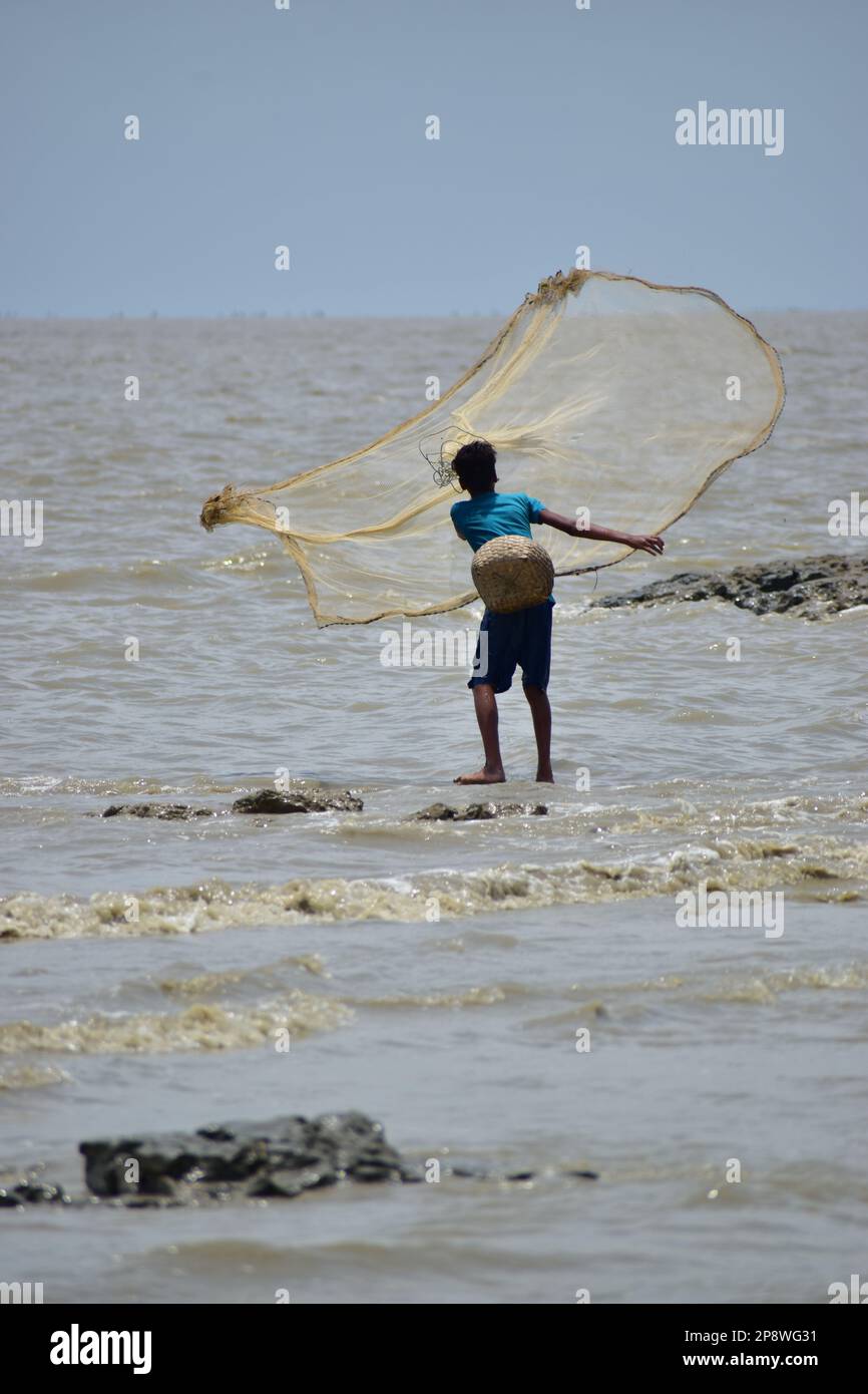 he is a little fisherman of sandwip,Chittagong. Stock Photo