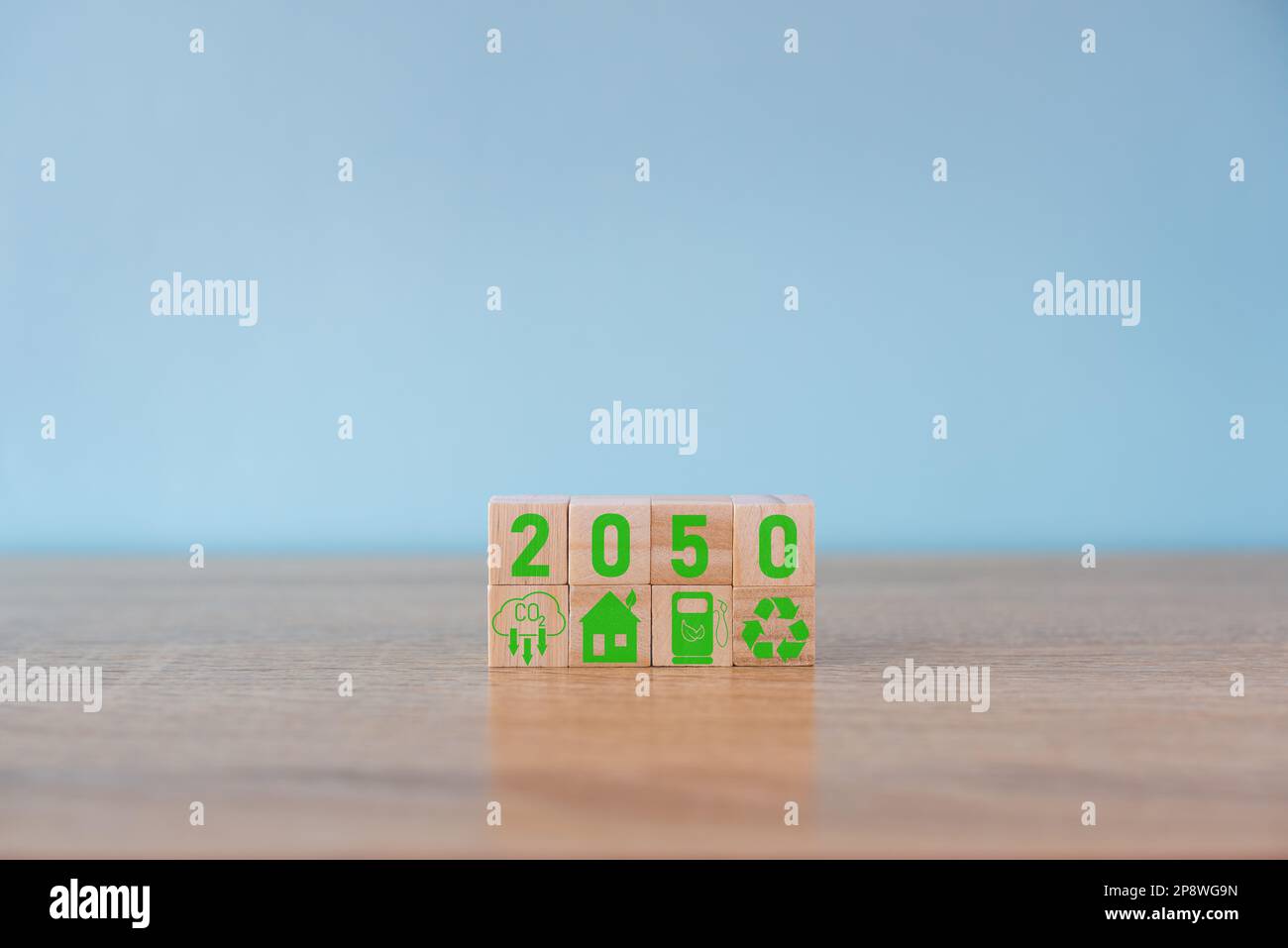 Carbon neutral concept. Net zero greenhouse gas emissions target. Climate neutral long term strategy. Stacking wooden cubes with green net zero Stock Photo