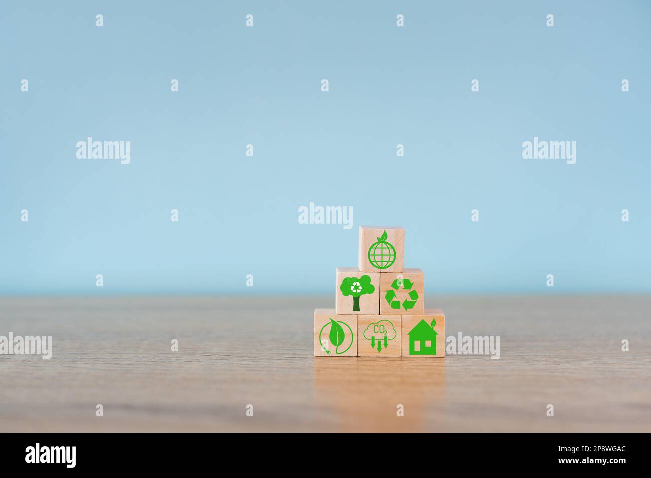 Carbon neutral concept. Net zero greenhouse gas emissions target. Climate neutral long term strategy. Stacking wooden cubes with green net zero Stock Photo