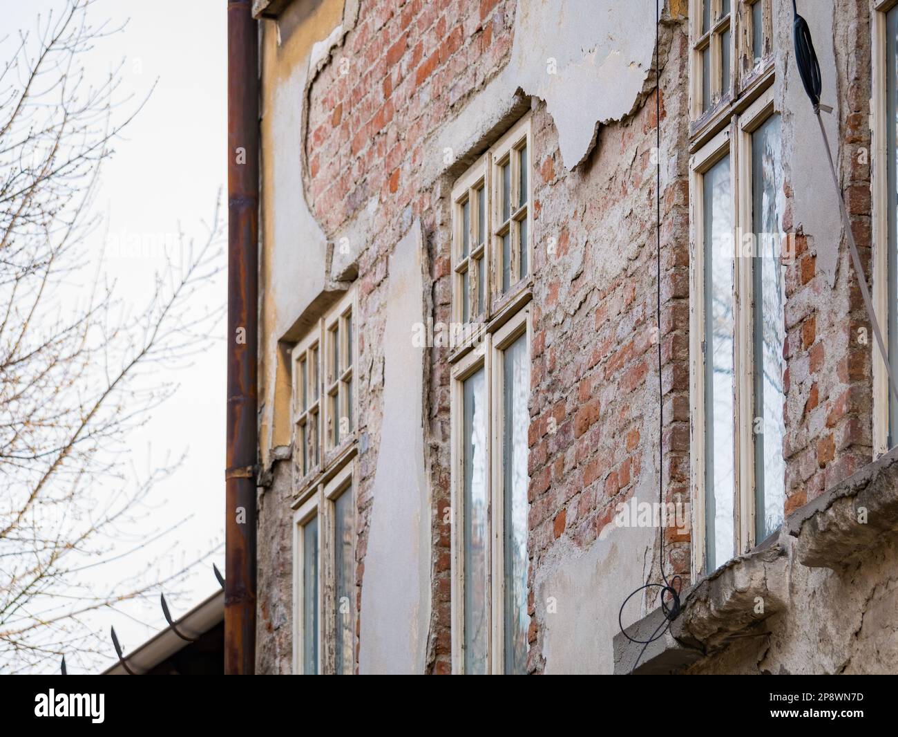 Detail with an old worn out building. Old vintage architecture in