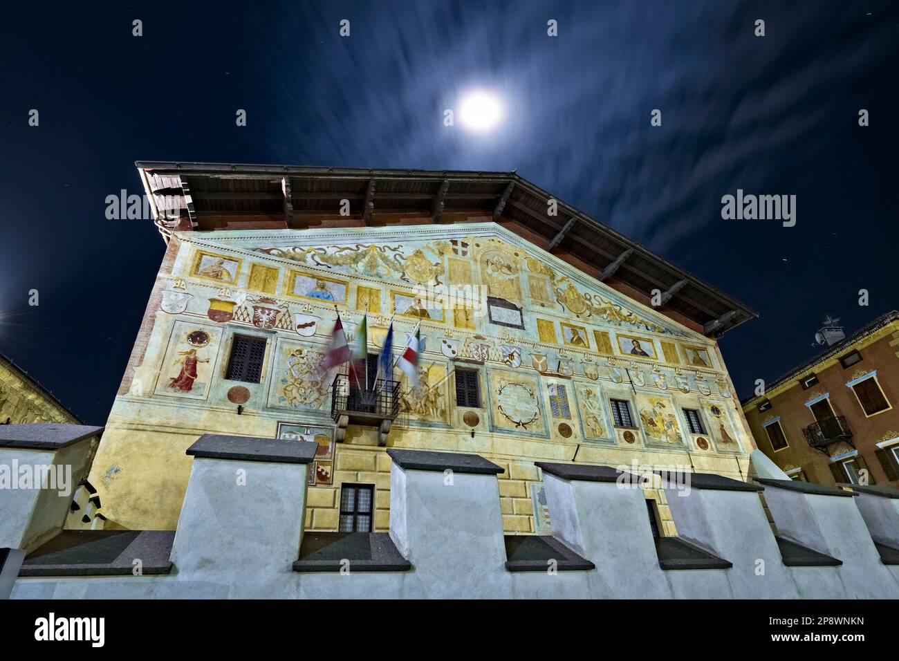 The frescoed facade of the palace of the Magnificent Community of Fiemme di Cavalese. Fiemme Valley, Trentino, Italy. Stock Photo