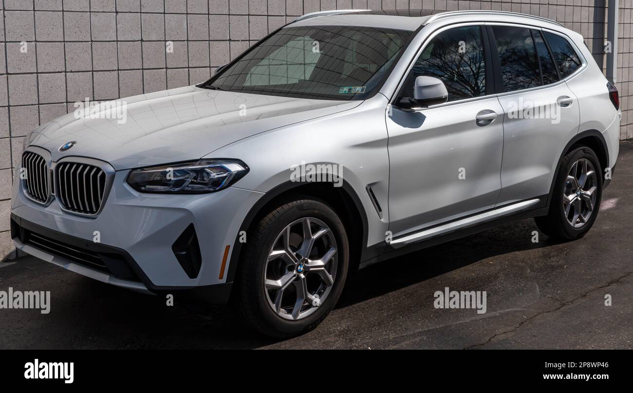 A new, white BMW SUV for sale at a dealership in Sewickley
