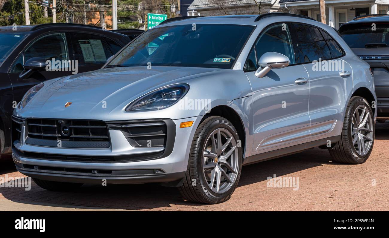 A silver Porsche SUV for sale at a dealership in Sewickley