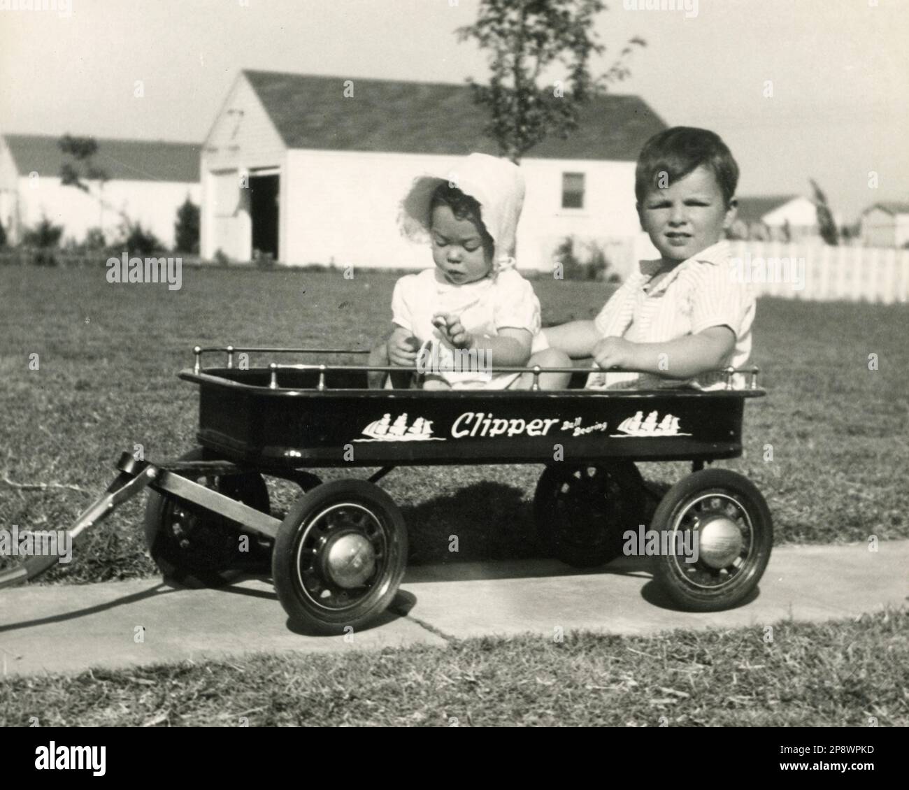 Little Red Wagon, Children in Yankee Clipper Wagon, Children Playing, about 1930s, 1940s 1950s Stock Photo