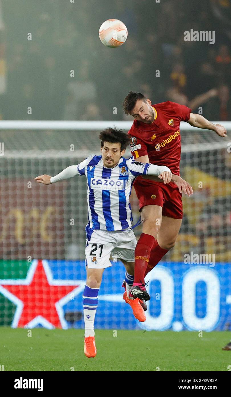 Stadio Olimpico, Rome, Italy. 9th Mar, 2023. Europa League Football, Round of 16 1st Leg; Roma versus Real Sociedad; David Silva of Real Sociedad challenges for a header with Bryan Cristante of AS Roma Credit: Action Plus Sports/Alamy Live News Stock Photo