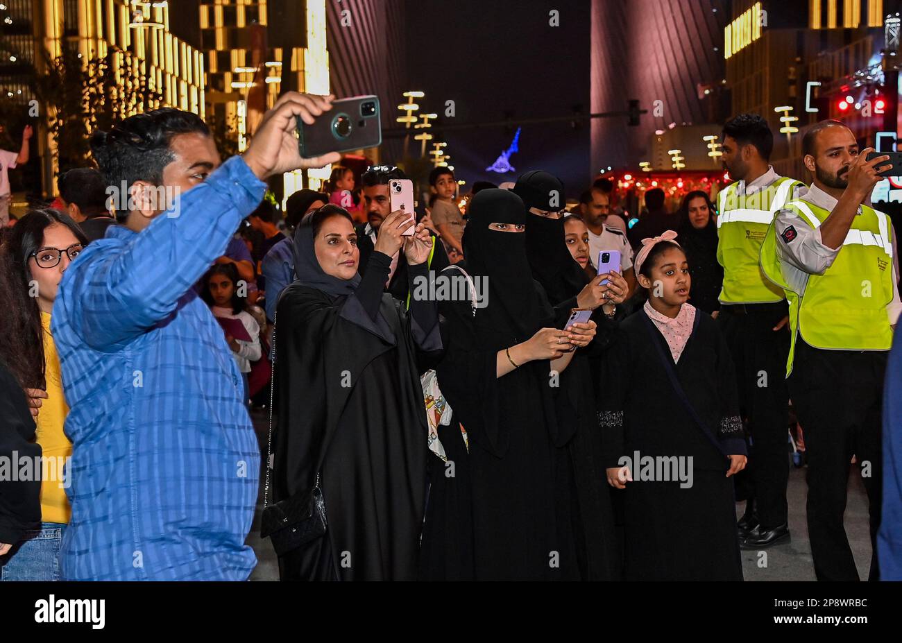 Doha, Qatar. 09th Mar, 2023. People take photos during artists perform global street art performances as part of the three-day Darb Lusail Parade at The Lusail Boulevard in Lusail city Doha, Qatar on 09 March 2023. (Photo by Noushad Thekkayil/NurPhoto) Credit: NurPhoto SRL/Alamy Live News Stock Photo