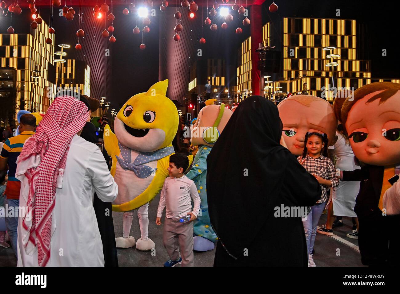 Doha, Qatar. 09th Mar, 2023. People take photos during artists perform global street art performances as part of the three-day Darb Lusail Parade at The Lusail Boulevard in Lusail city Doha, Qatar on 09 March 2023. (Photo by Noushad Thekkayil/NurPhoto) Credit: NurPhoto SRL/Alamy Live News Stock Photo