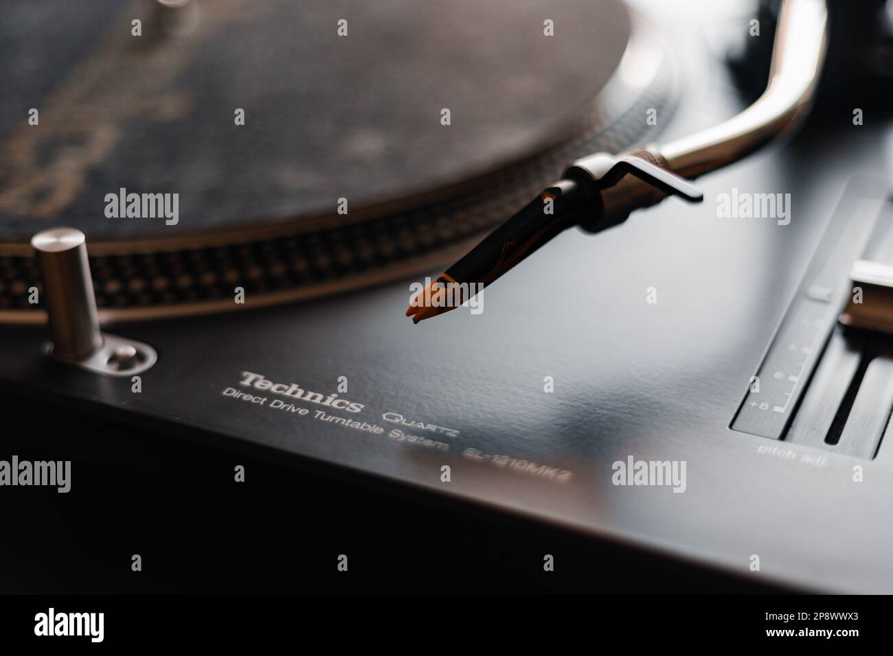 A closeup of iconic technics 1210 mk2 turntables with ortofon