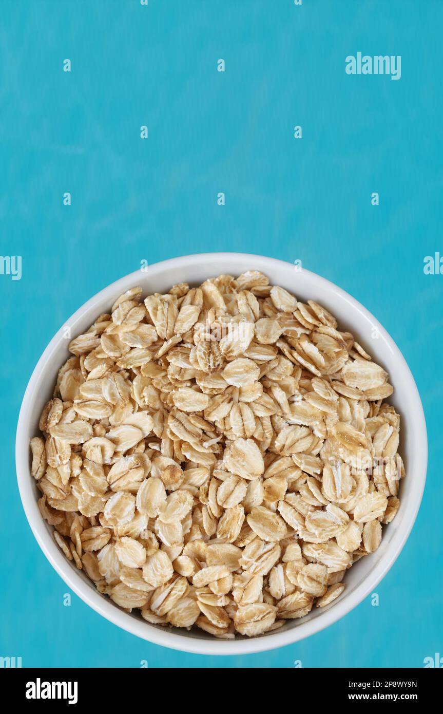 Picture of organic oat flakes in a bowl, selective focus. Stock Photo