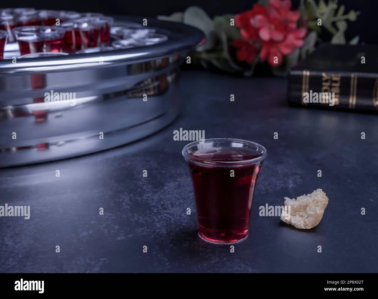 Taking communion concept - the wine and the bread symbols of Jesus Christ blood and body with Holy Bible. Easter Passover and Lord Supper concept. Stock Photo