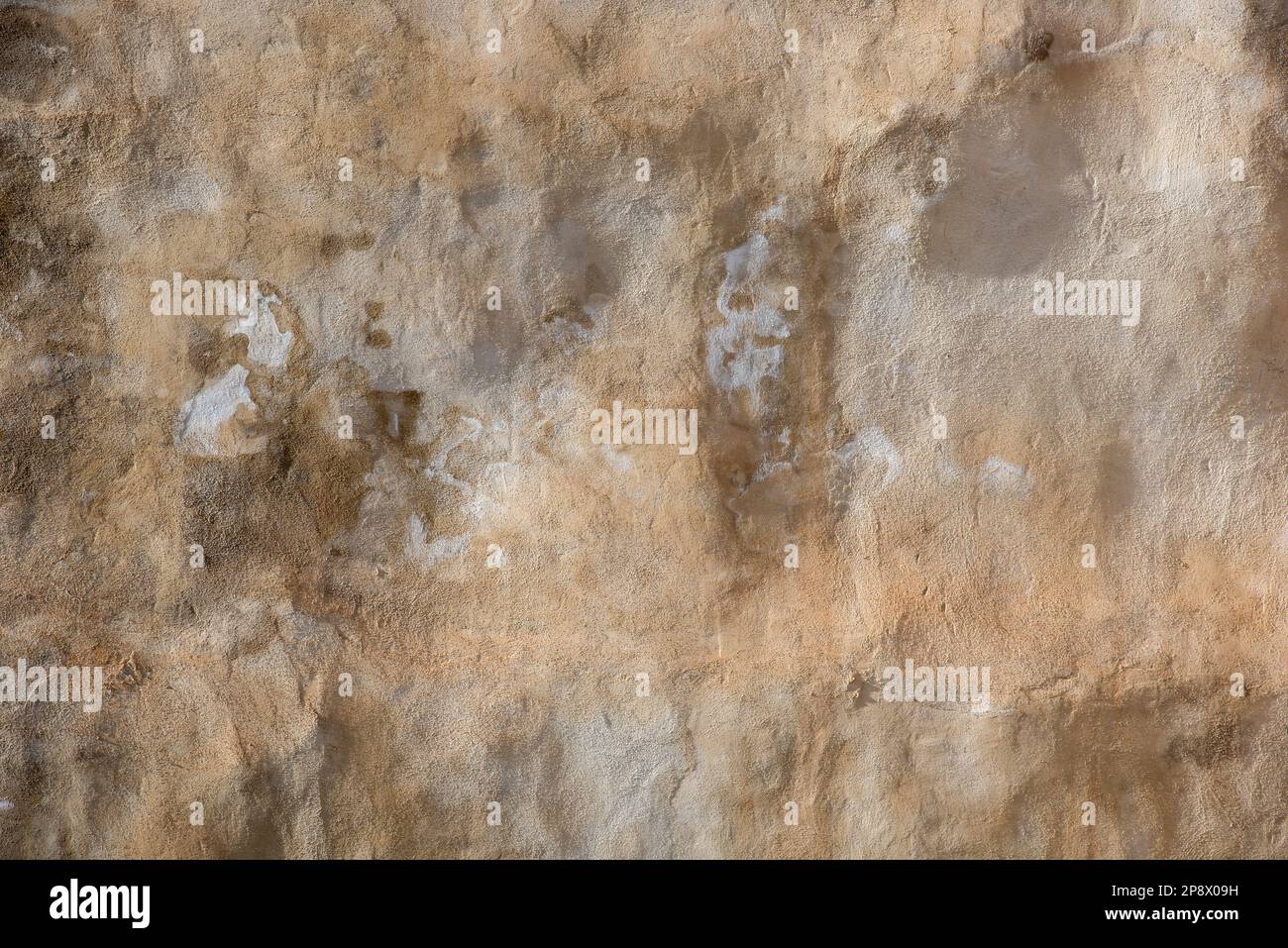 Detalle de un antiguo muro medieval hecho con piedras, ladrillos y otros materiales, textura Stock Photo