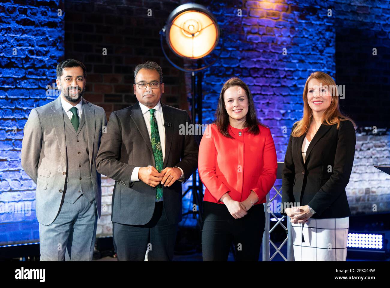 Presenter Krishnan Guru-Murthy (second left) with SNP leadership candidates Humza Yousaf (left), Kate Forbes (second right) and Ash Regan (right) on set before taking part in the SNP leadership debate, broadcast on Channel 4, from The Engine Works in Glasgow, Scotland. Picture date: Thursday March 9, 2023. Stock Photo