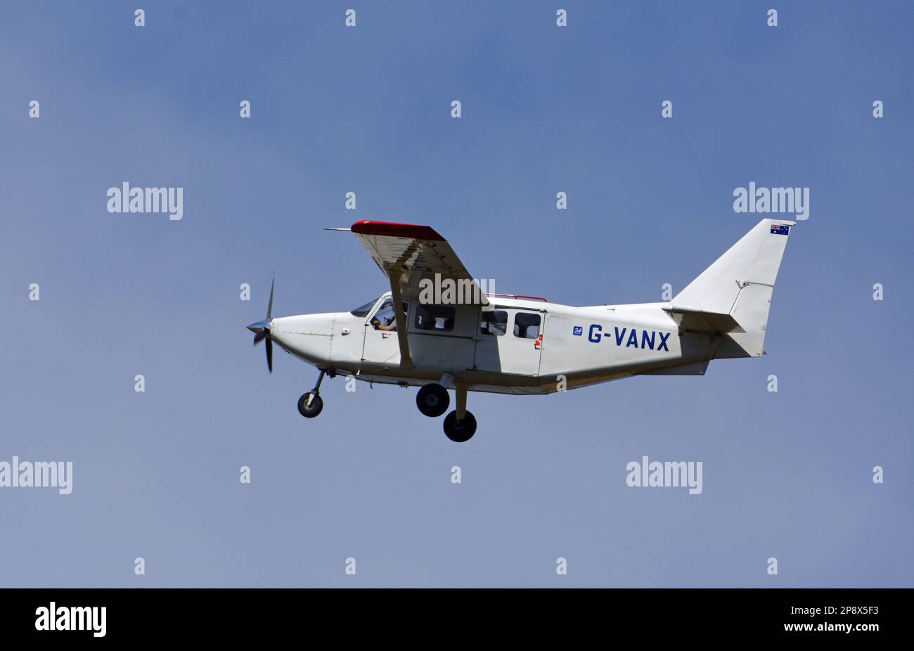 ICKWELL, BEDFORDSHIRE, ENGLAND - AUGUST 07, 2022: Gippsland GA-8TC Airvan aircraft in flight blue sky. Stock Photo