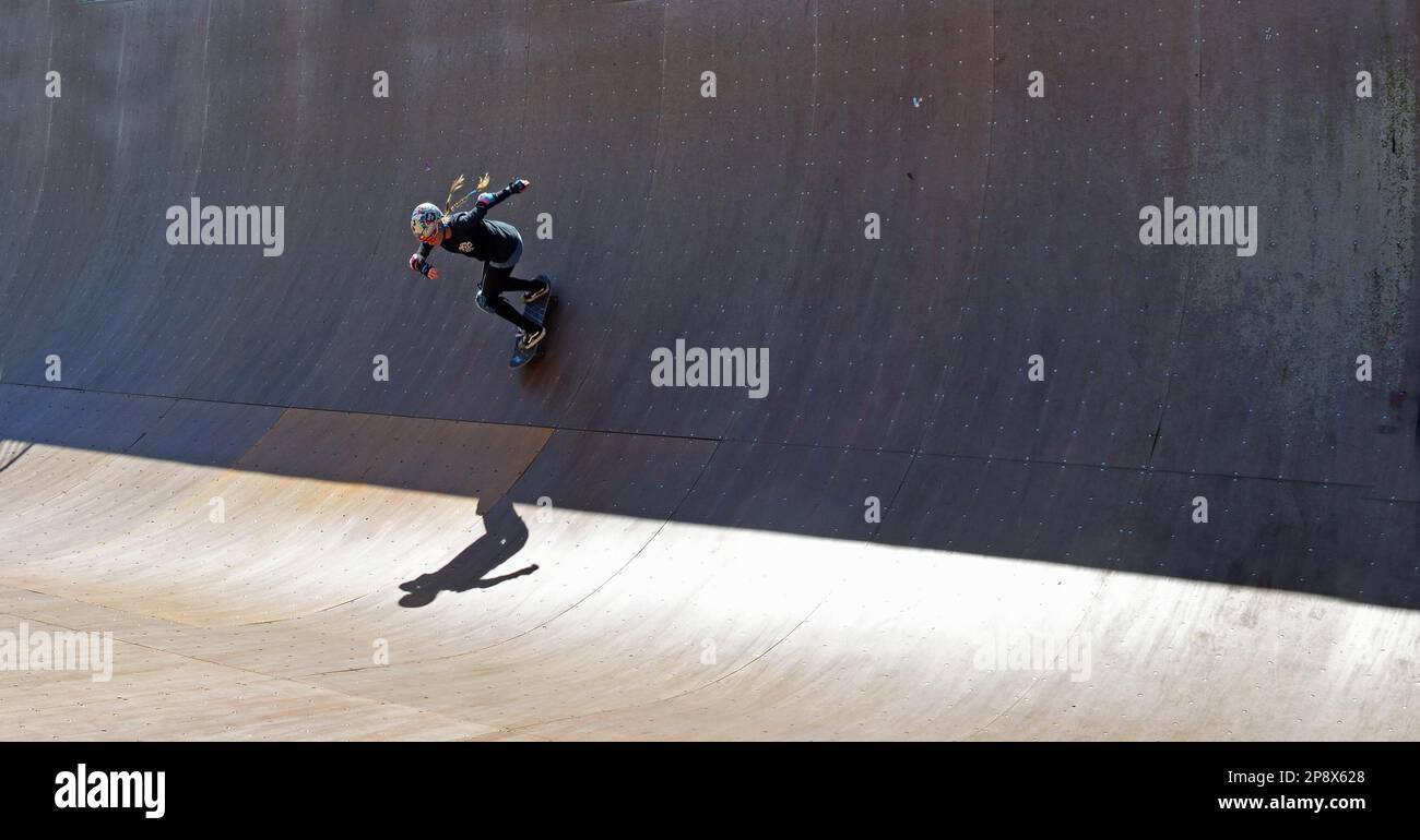 Girl skateboarding on vert ramp in the sunshine sharp shadow Stock ...