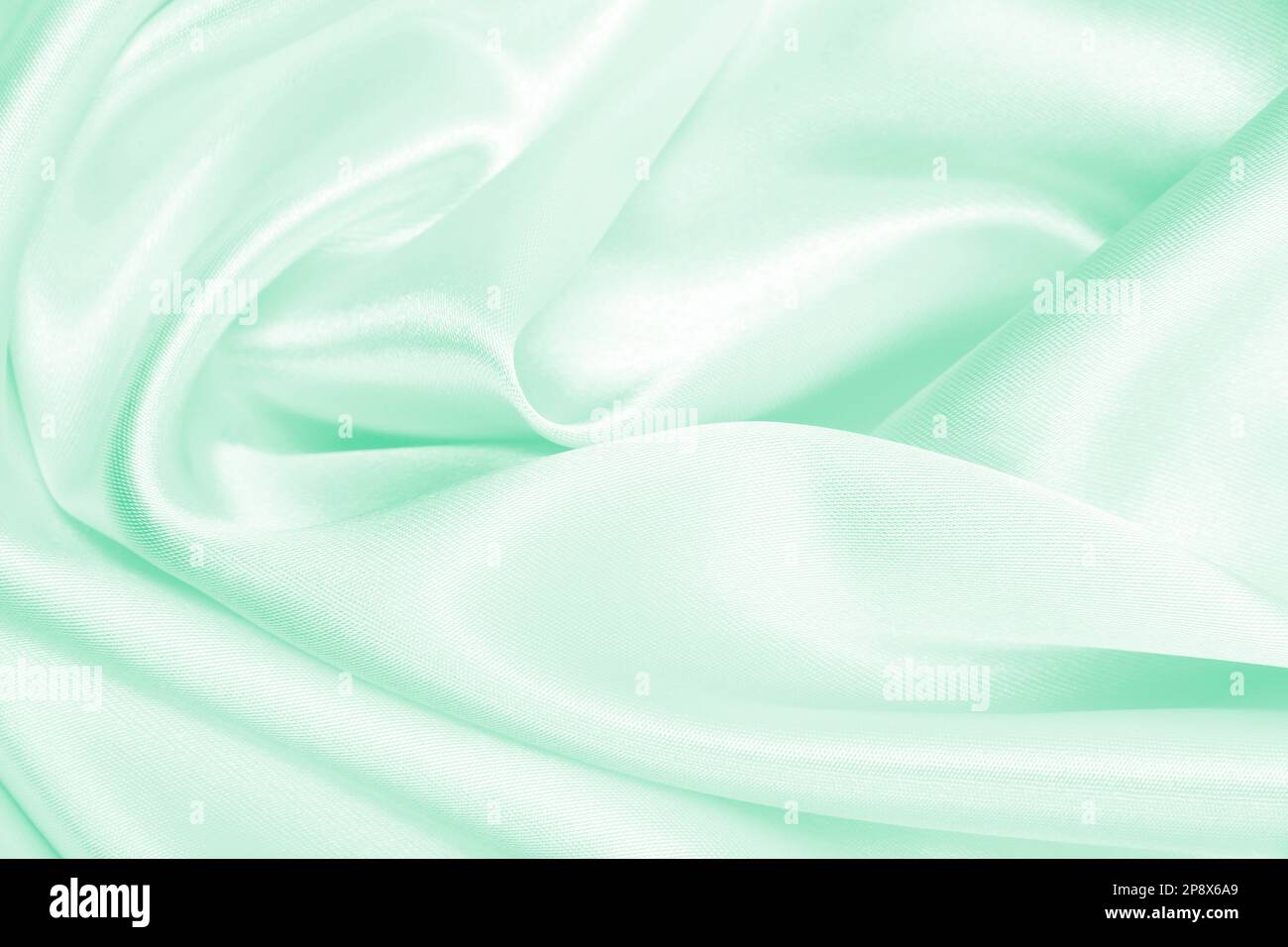 Smooth elegant green silk or satin luxury cloth texture can use as ...