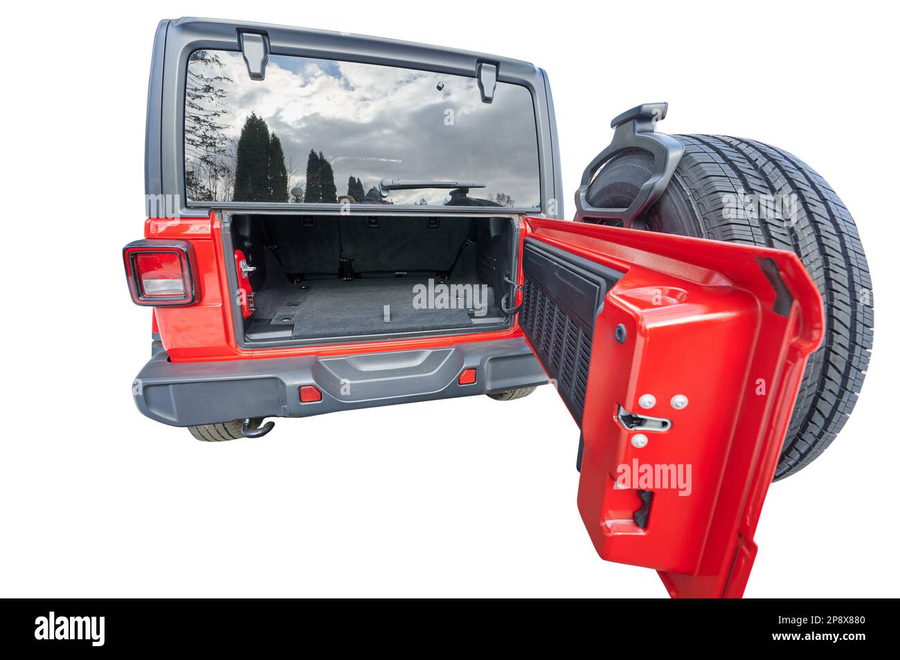 Half open red car trunk with spare tire isolated on studio background