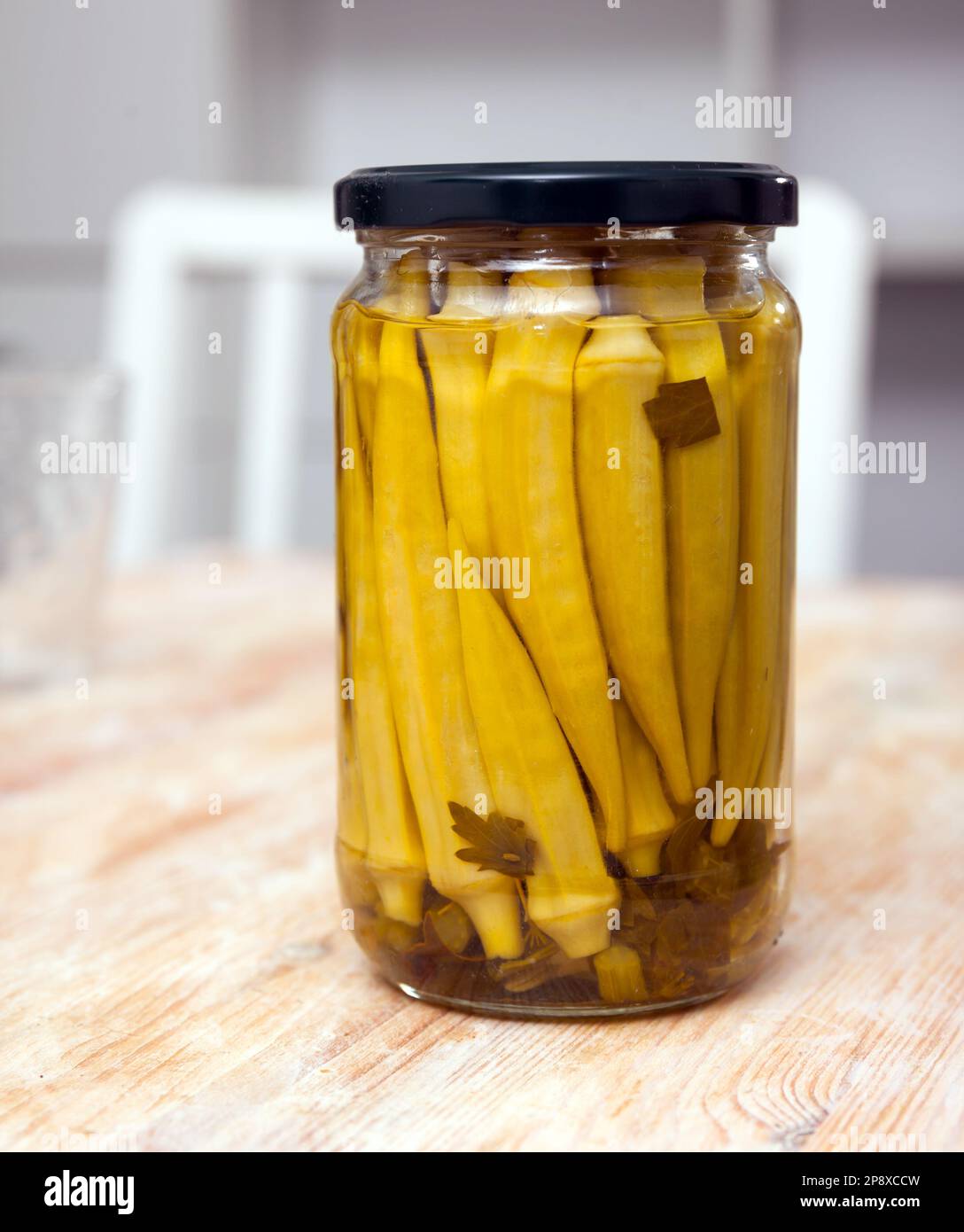 Glass jar with marinated okra on table Stock Photo Alamy