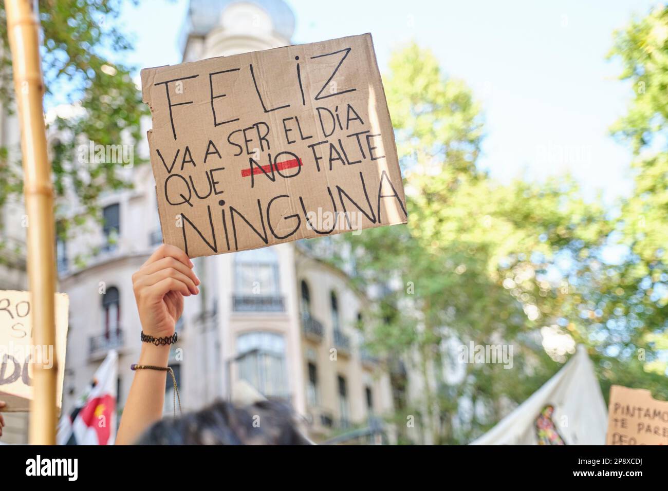 Buenos Aires, Argentina; March 8, 2023: International feminist strike, an unrecognizable woman holds up a sign with the text Happy will be the day tha Stock Photo