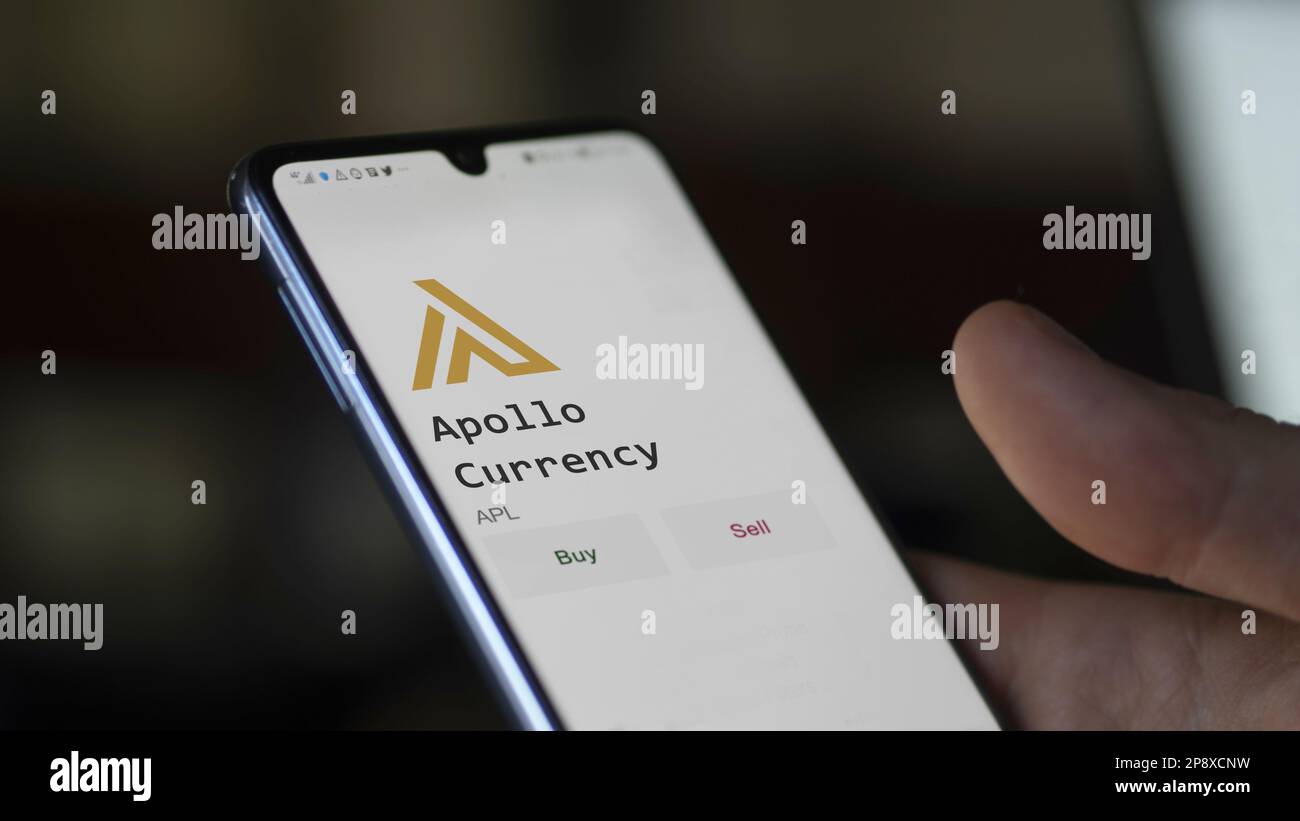 An investor's analyzing the Appolo Currency APL coin on screen. A phone ...
