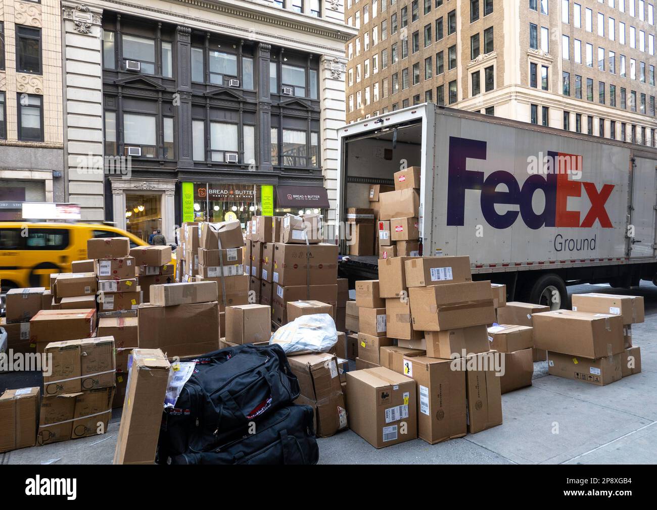 Stacks of boxes, ready for delivery by FedEx on fifth Avenue in midtown