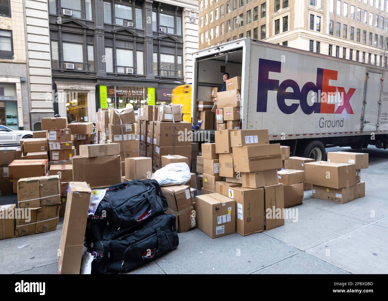 Stacks of boxes, ready for delivery by FedEx on fifth Avenue in midtown
