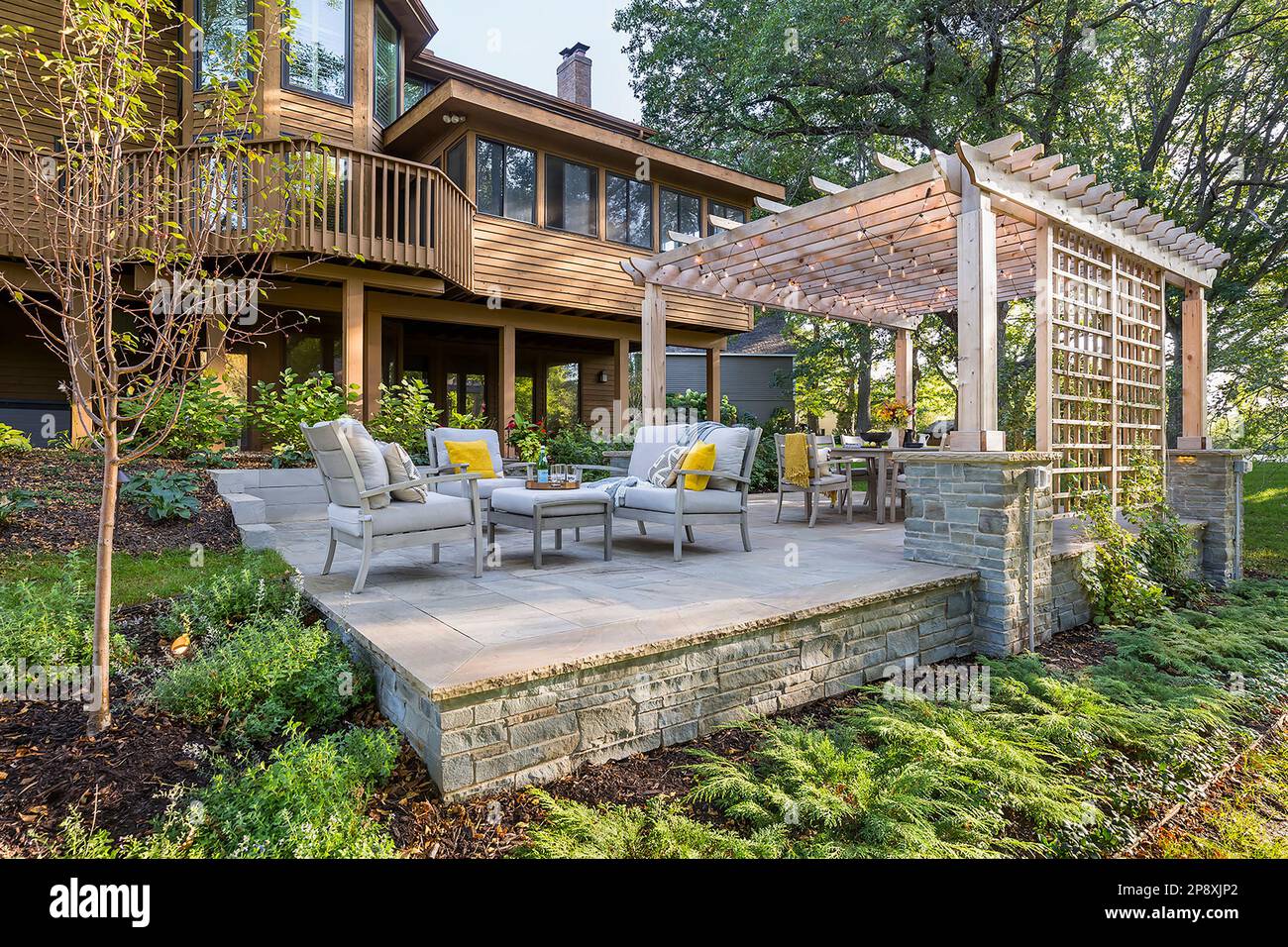 Bluestone patio with pergola in backyard Stock Photo Alamy