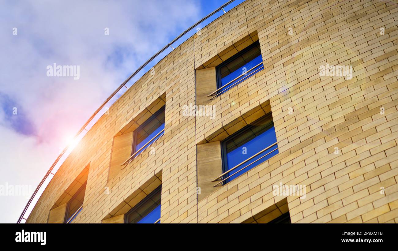 Detail of a modern yellow brick building with large windows Stock Photo ...
