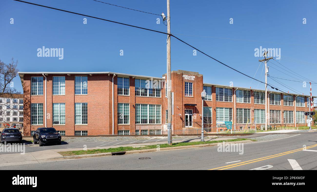 CHARLOTTE, NC-5 MARCH 2023: NoDa District.  Johnston Mfg. Co. mill building under renovation for apartments, by Wandry. Stock Photo