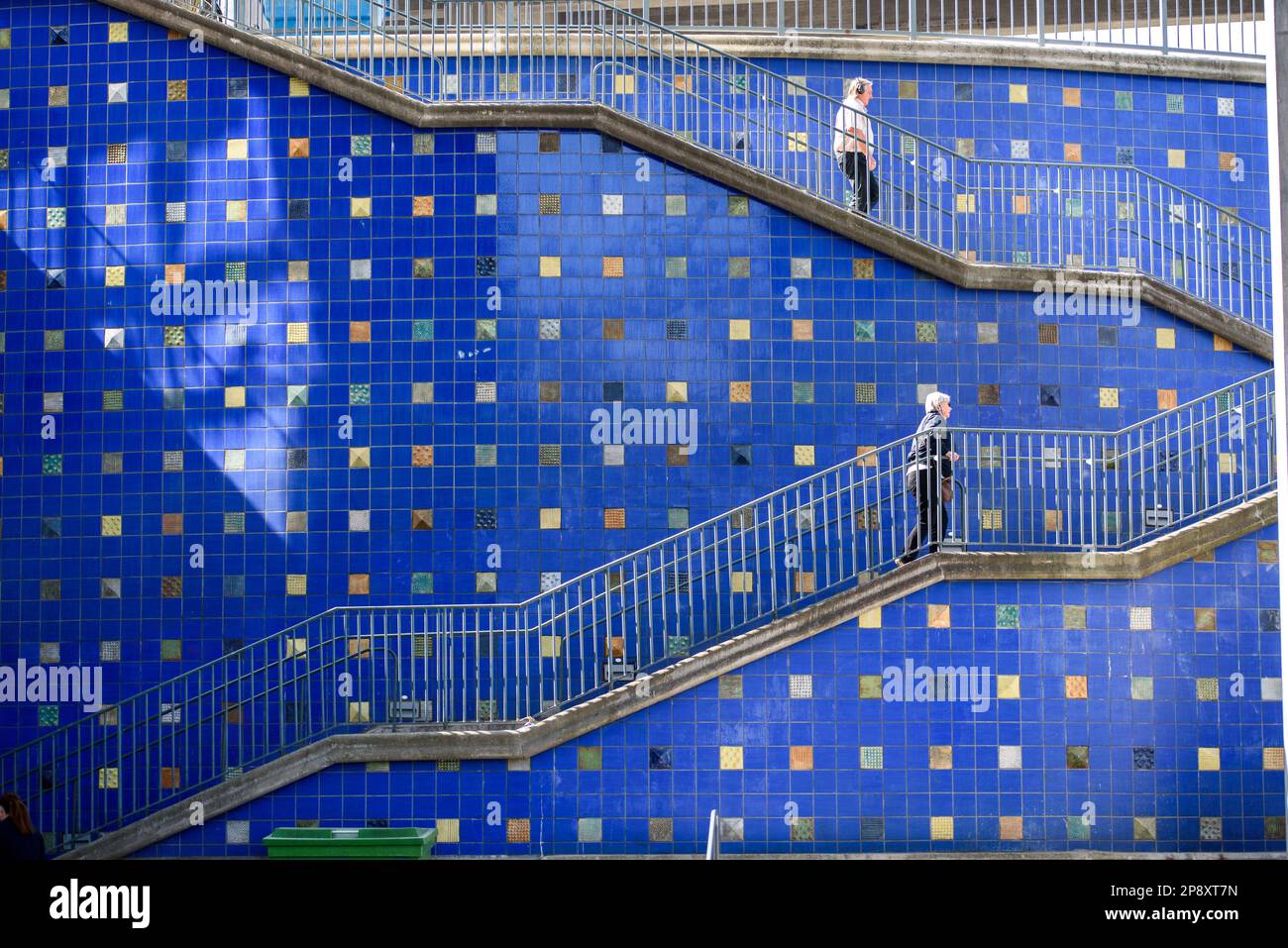 Grey metal staircase against a blue wall in Stockholm, Hammarby Stock Photo