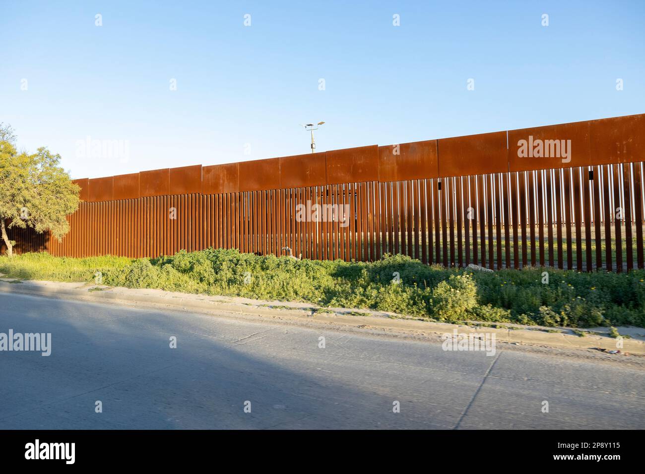 Tijuana, Baja California, Mexico - The U.S.-Mexico border wall, looking north across Vía de la Juventud Ote from the airport Stock Photo