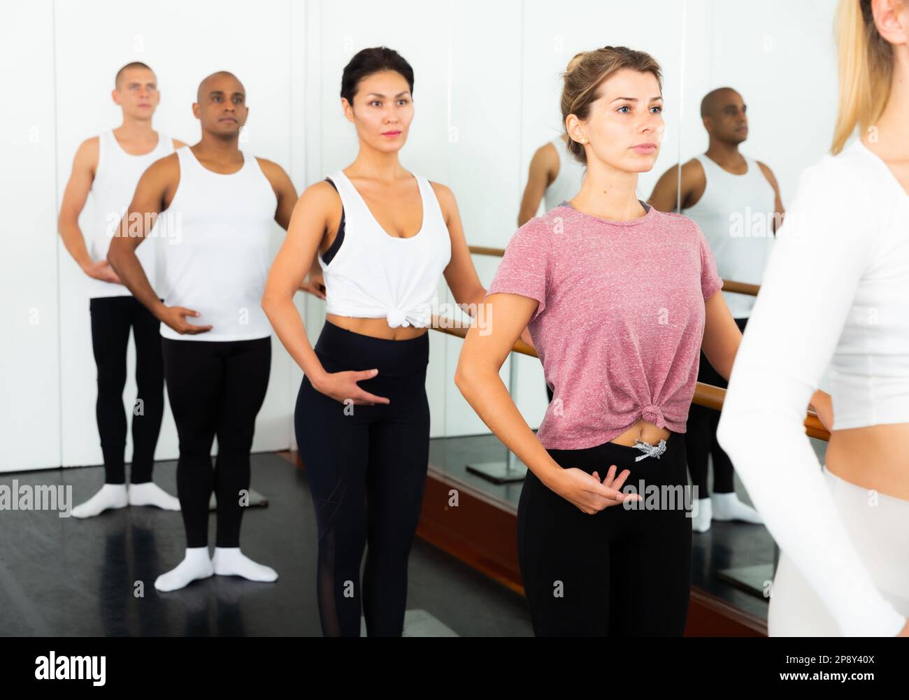 Dancers doing exercises on stretching ballet barre Stock Photo Alamy