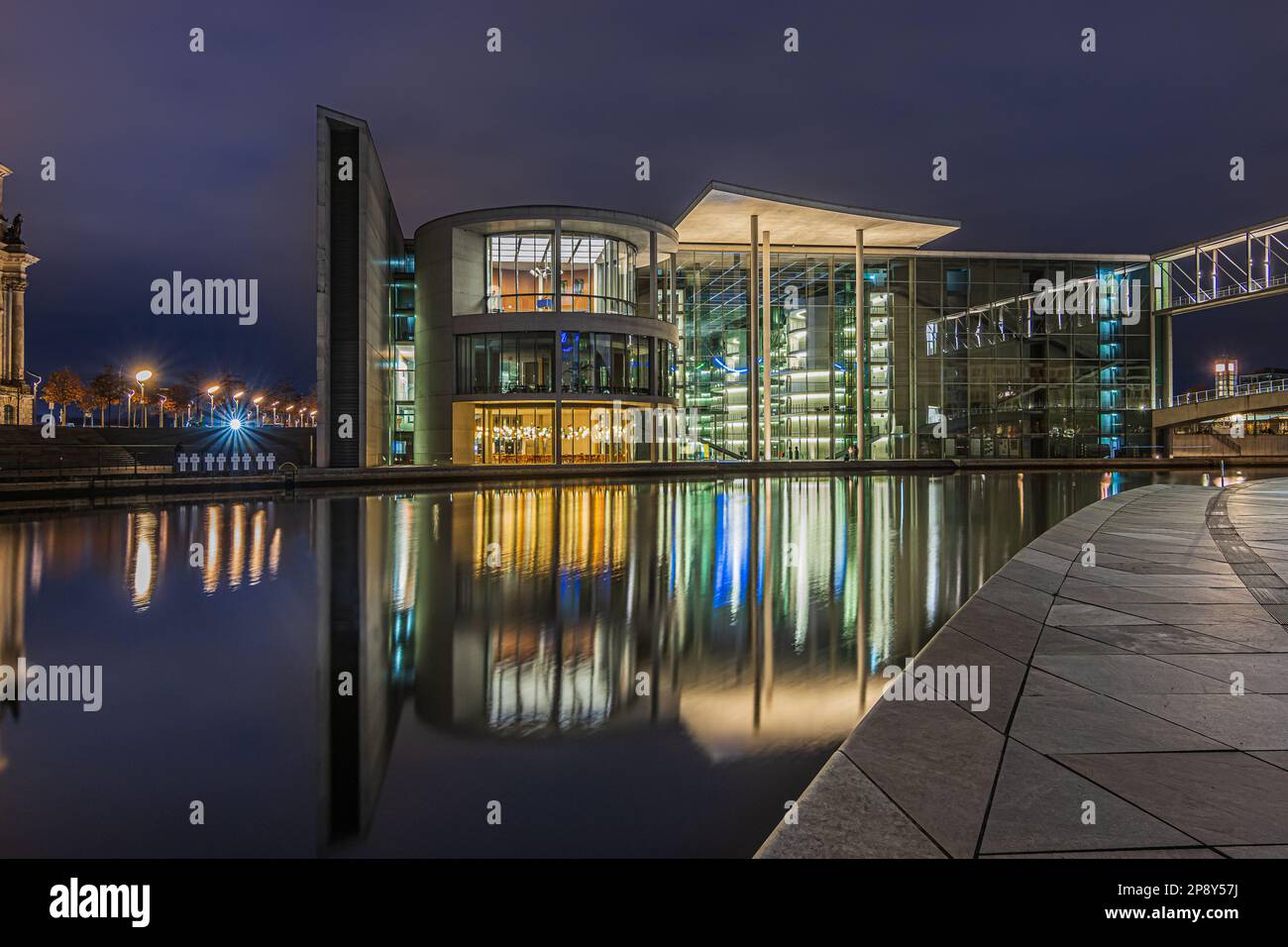 View of government buildings at night time. Paul Löbe House in Berlin at the blue hour. Illuminated buildings. Spreeufer at the blue hour. River Spree Stock Photo