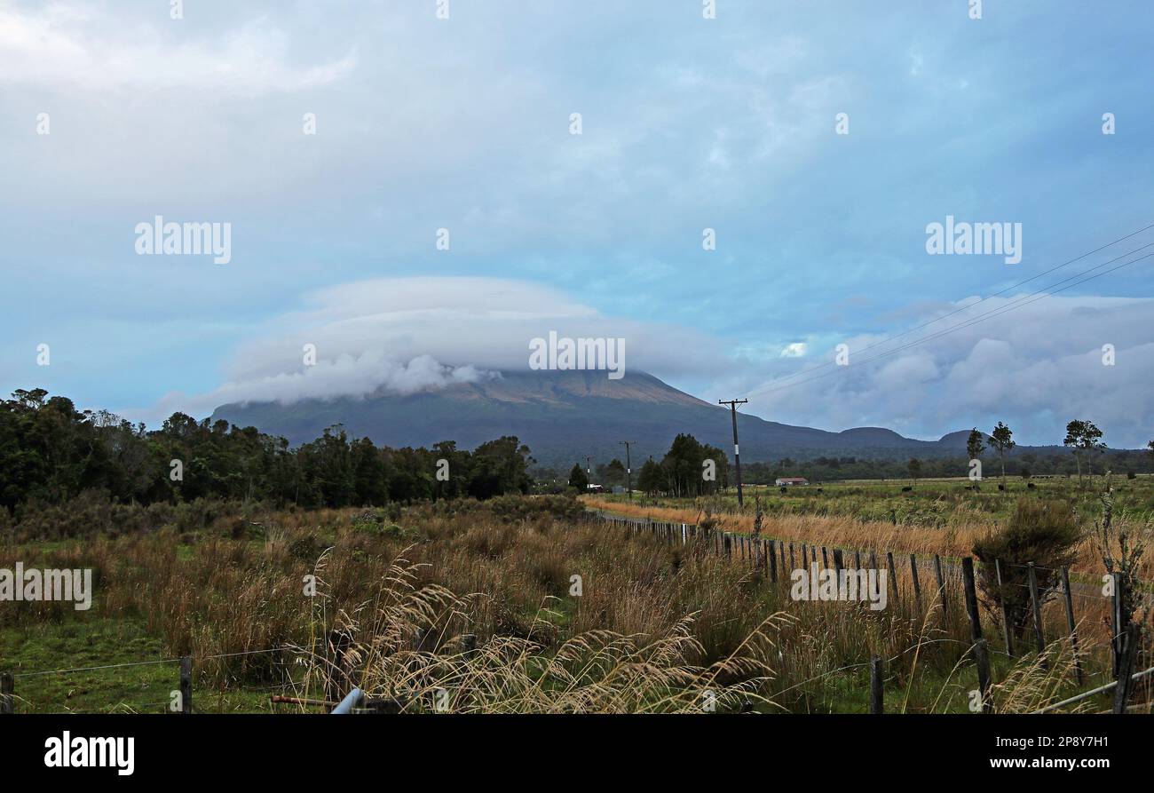 Taranaki in beanie of clouds - New Zealand Stock Photo