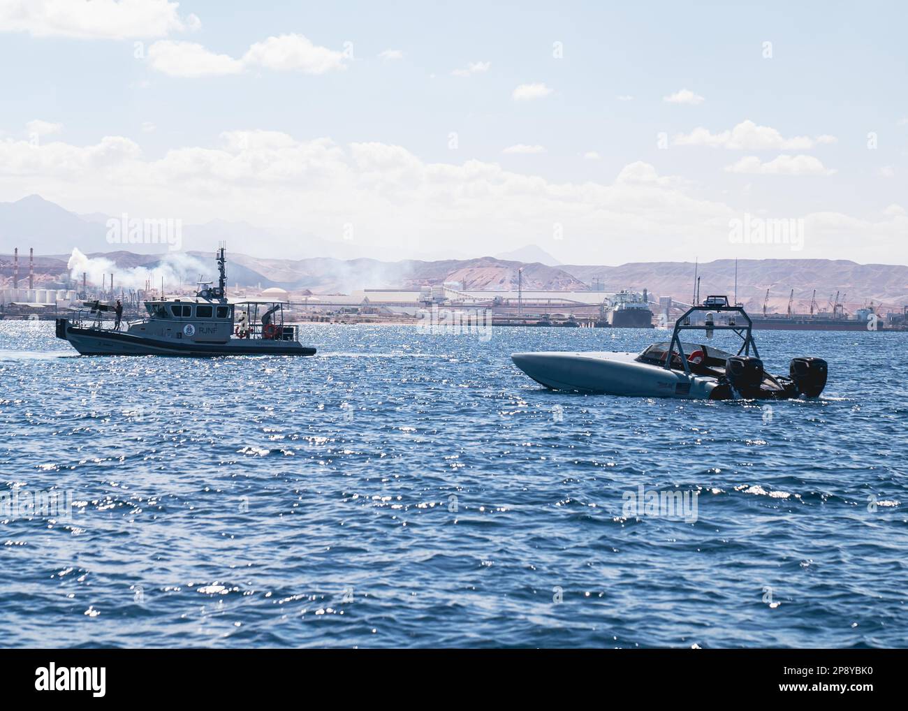 230308-A-NR779-1016 GULF OF AQABA (March 8, 2023) A MARTAC T-38 Devil Ray unmanned surface vessel operates alongside a Royal Jordanian Navy vessel in the Gulf of Aqaba, March 8, 2023, during International Maritime Exercise 2023. IMX/CE 2023 is the largest multinational training event in the Middle East, involving 7,000 personnel from more than 50 nations and international organizations committed to preserving the rules-based international order and strengthening regional maritime security cooperation. (U.S. Army photo by Spc. Aaron Troutman) Stock Photo