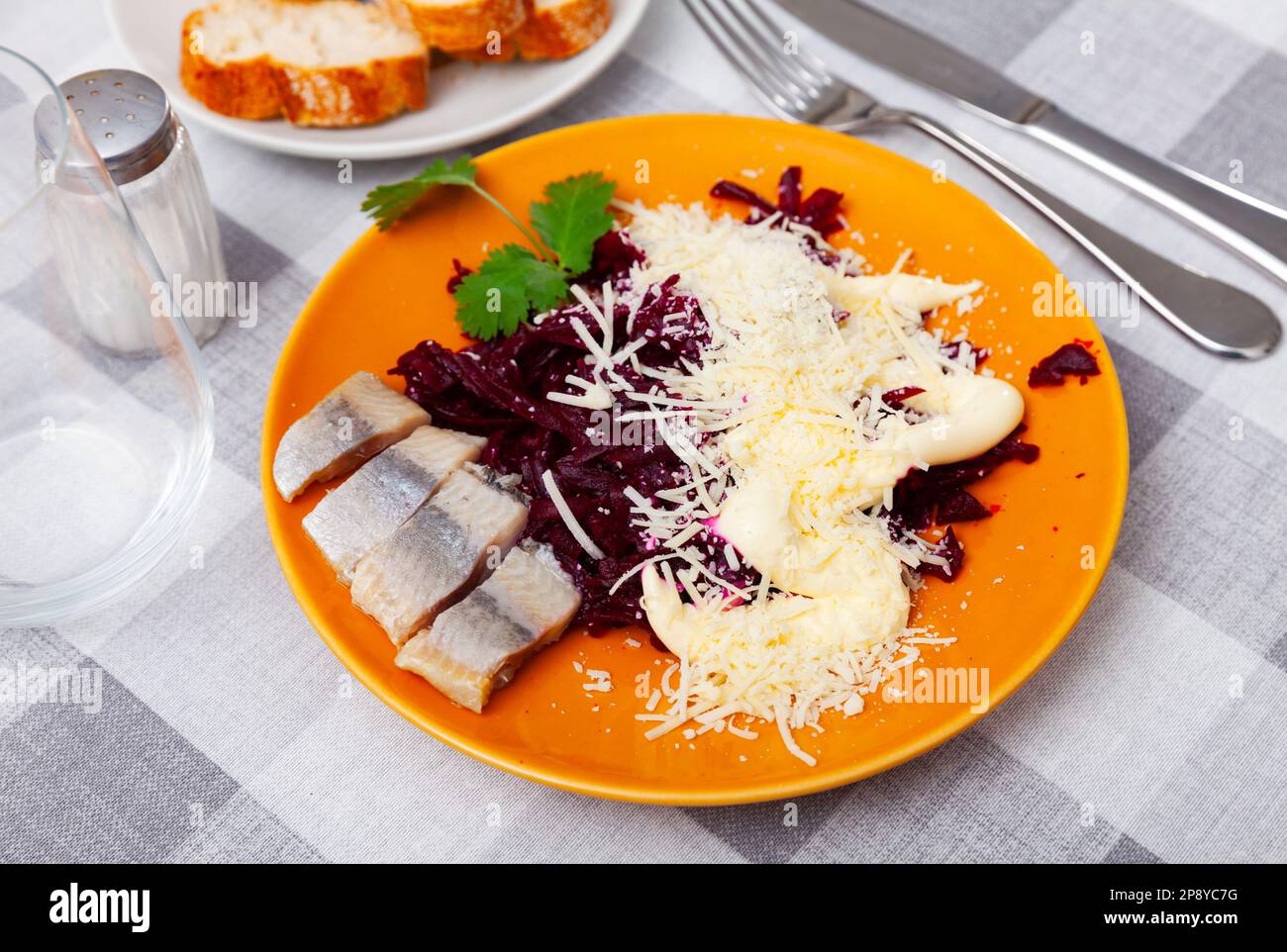 Beetroot served with cheese and pickled mackerel Stock Photo