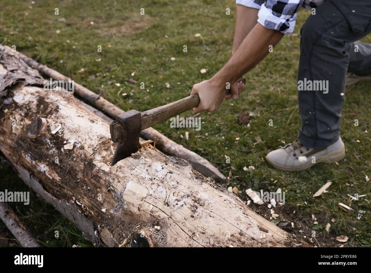 Male hands cutting wood log hi-res stock photography and images - Alamy