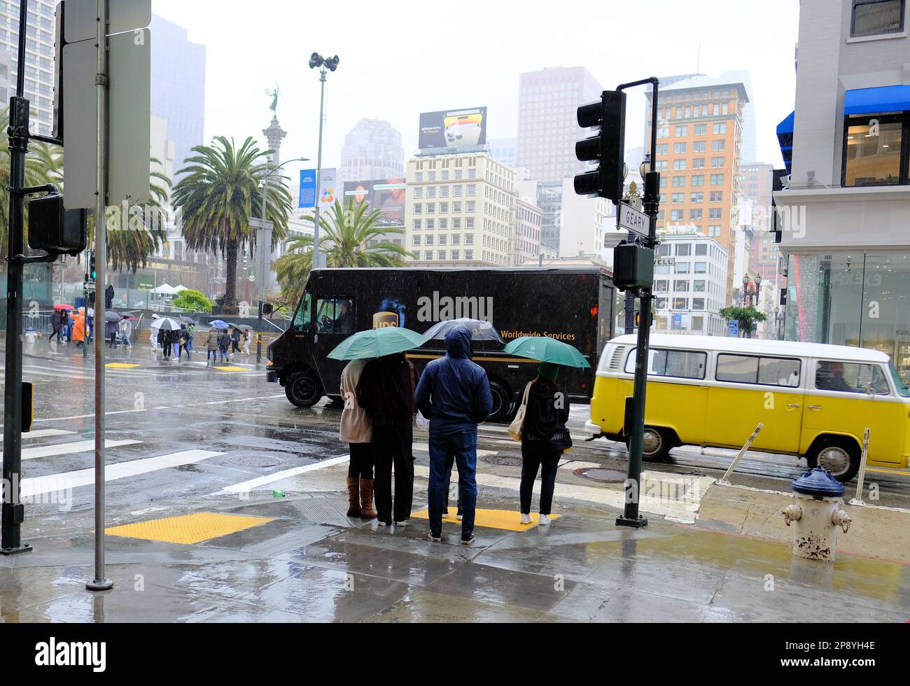 Pedestrians and tourists in the rain in downtown San Francisco