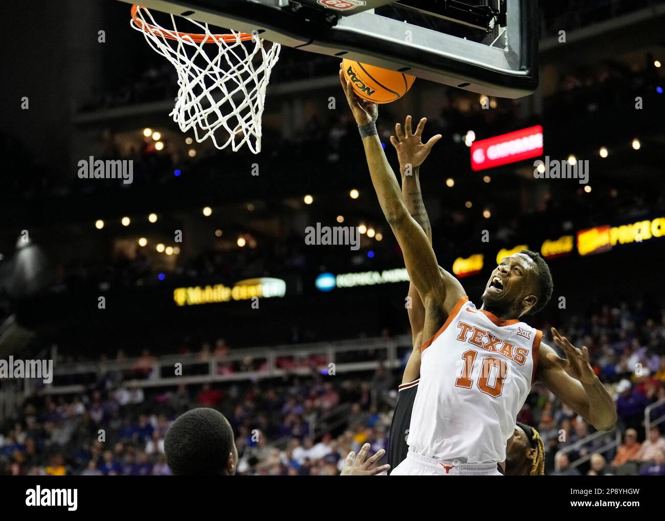 MAR 09 2023 Texas guard Sir'Jabari Rice (10) scores under the basket