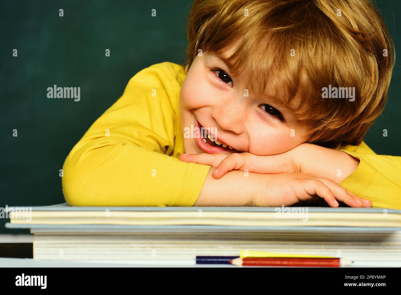 Educational process. Preschooler. Home schooling. School or college pupil showing parents a test with good grade. Stock Photo