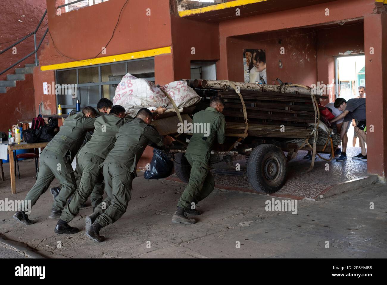 Border police agents push a cart containing a disassembled boxing ring ...
