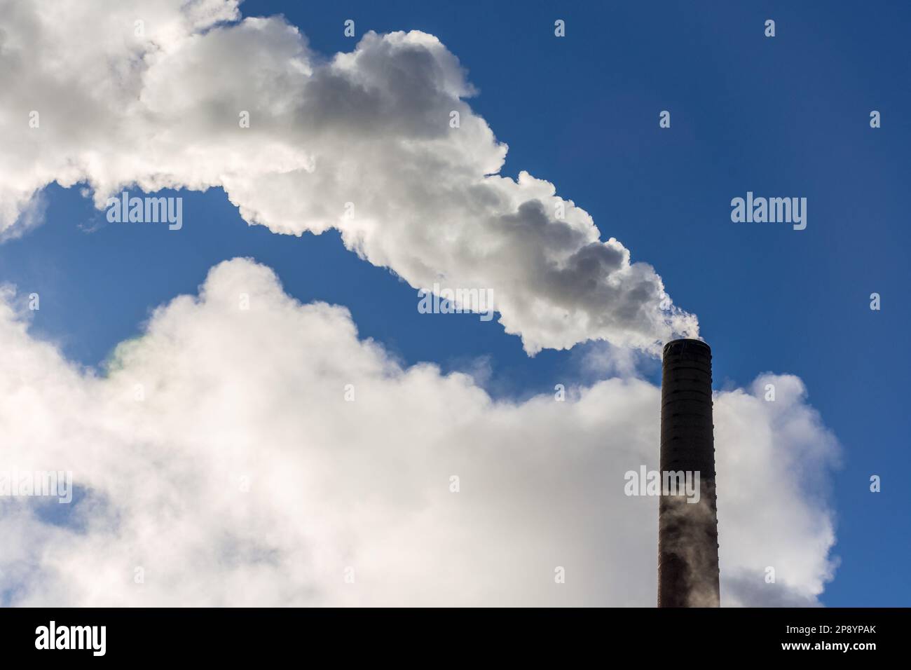 Smoke coming oit of chimney in Tampere Finland Stock Photo