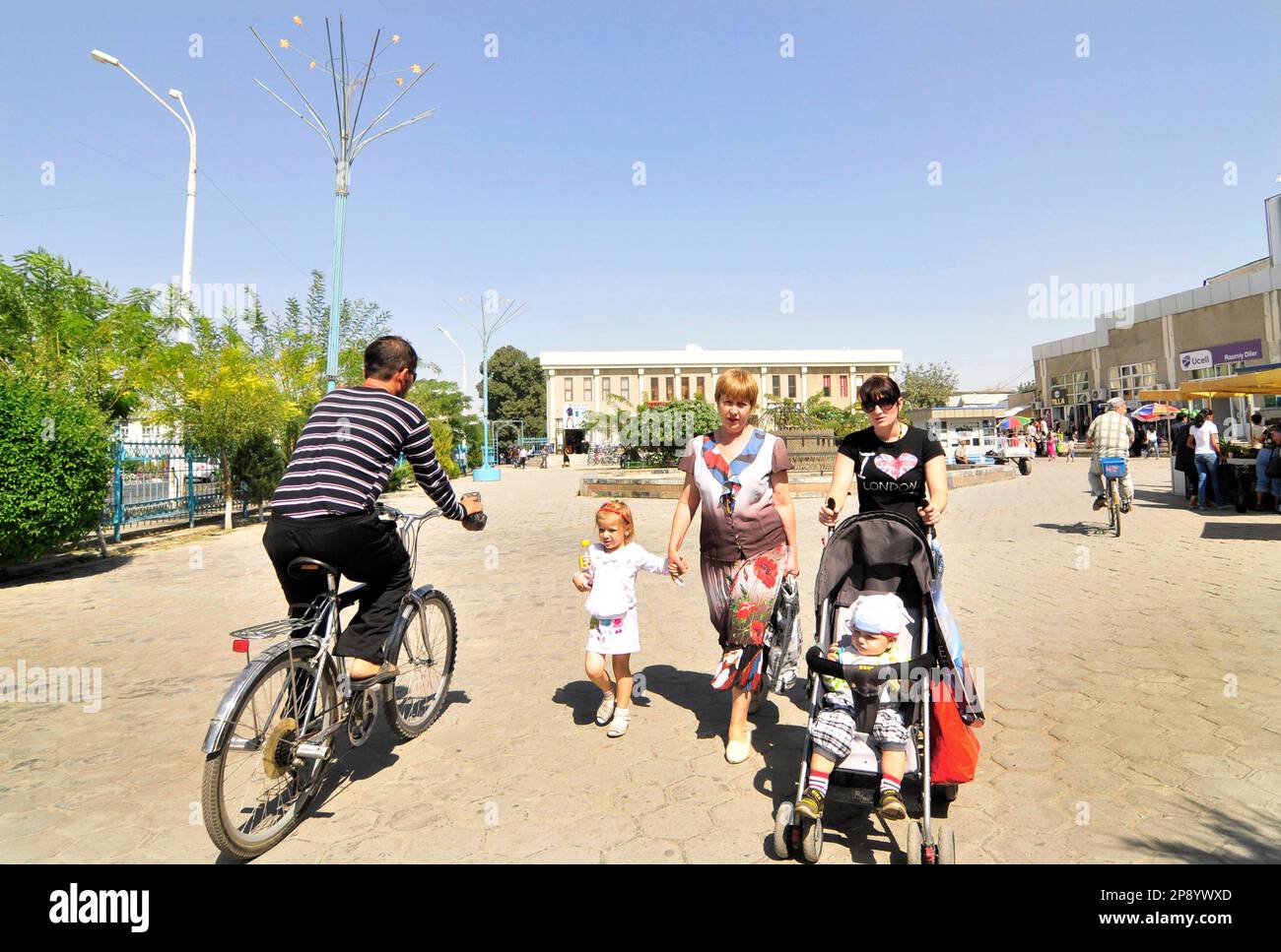 Uzbek-Russian women with their children in Bukhara, Uzbekistan. Stock Photo