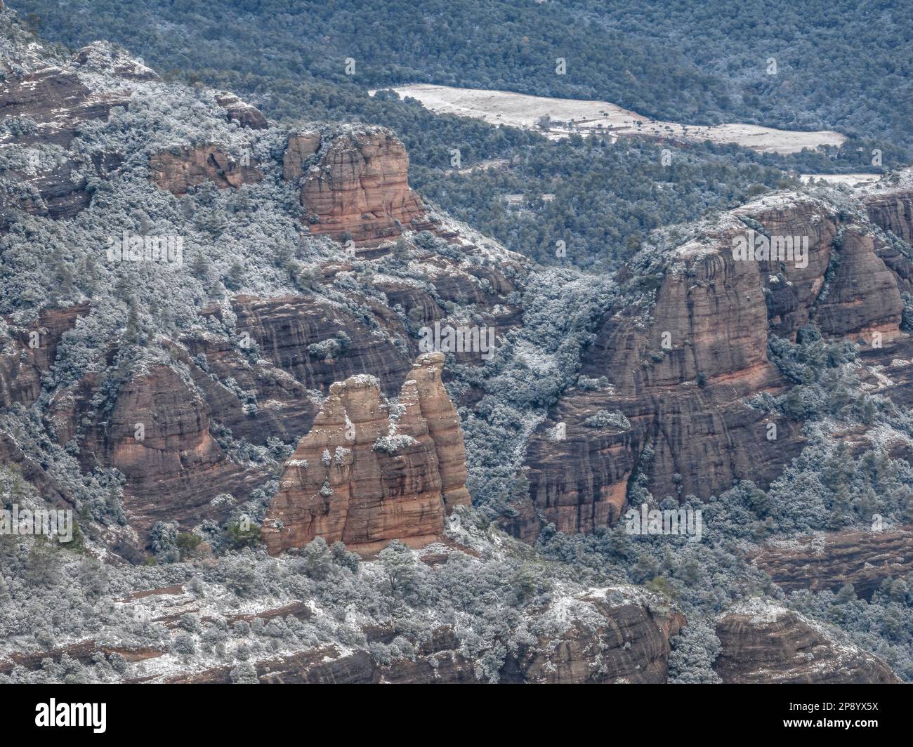 Aerial view of the snowy Castellassa de Can Torres rock, on the Mola mountain, after the snowfall of 02-27-23, Matadepera, Barcelona, Catalonia, Spain Stock Photo