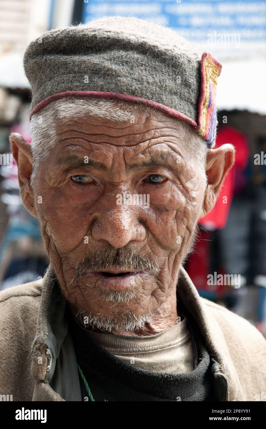 Local man in Old Manali, Himachal Pradesh, northern India. He wears the traditional cap of the region. Stock Photo