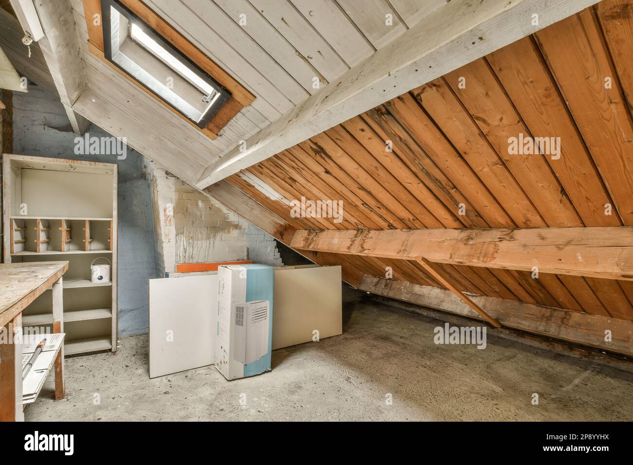 an unfinished attic with wood paneling on the walls and ceiling that ...