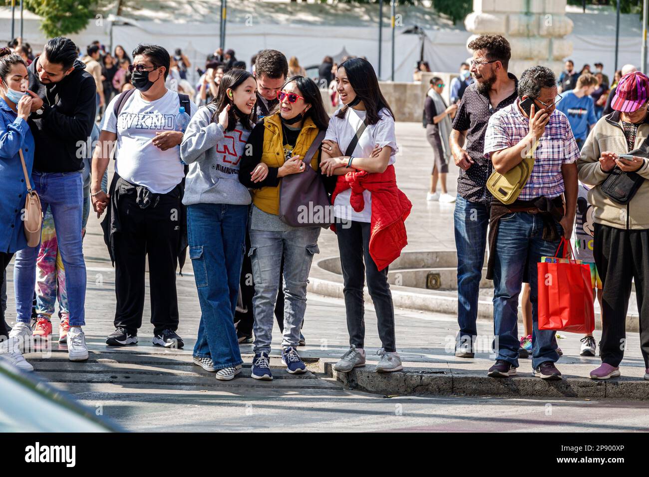 Mexico City,waiting for light signal change crossing,man men male,woman women lady female,adult adults,resident residents,couple couples,teen teens te Stock Photo