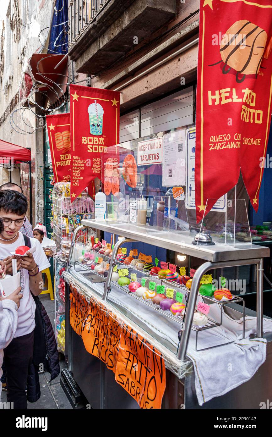Mexico City,Barrio Chino Chinatown,sweet steam buns bao,teen teens teenage teenager teenagers,youth culture friends adolescent,resident residents boy Stock Photo