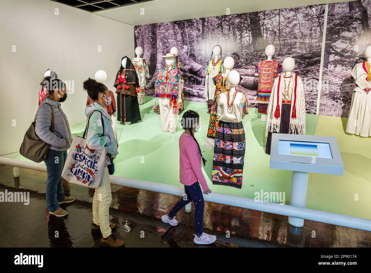 Mexico City,Museo de Arte Popular,folk art museum,regional traditional dresses,looking at woman women lady female,adult adults,resident residents frie Stock Photo