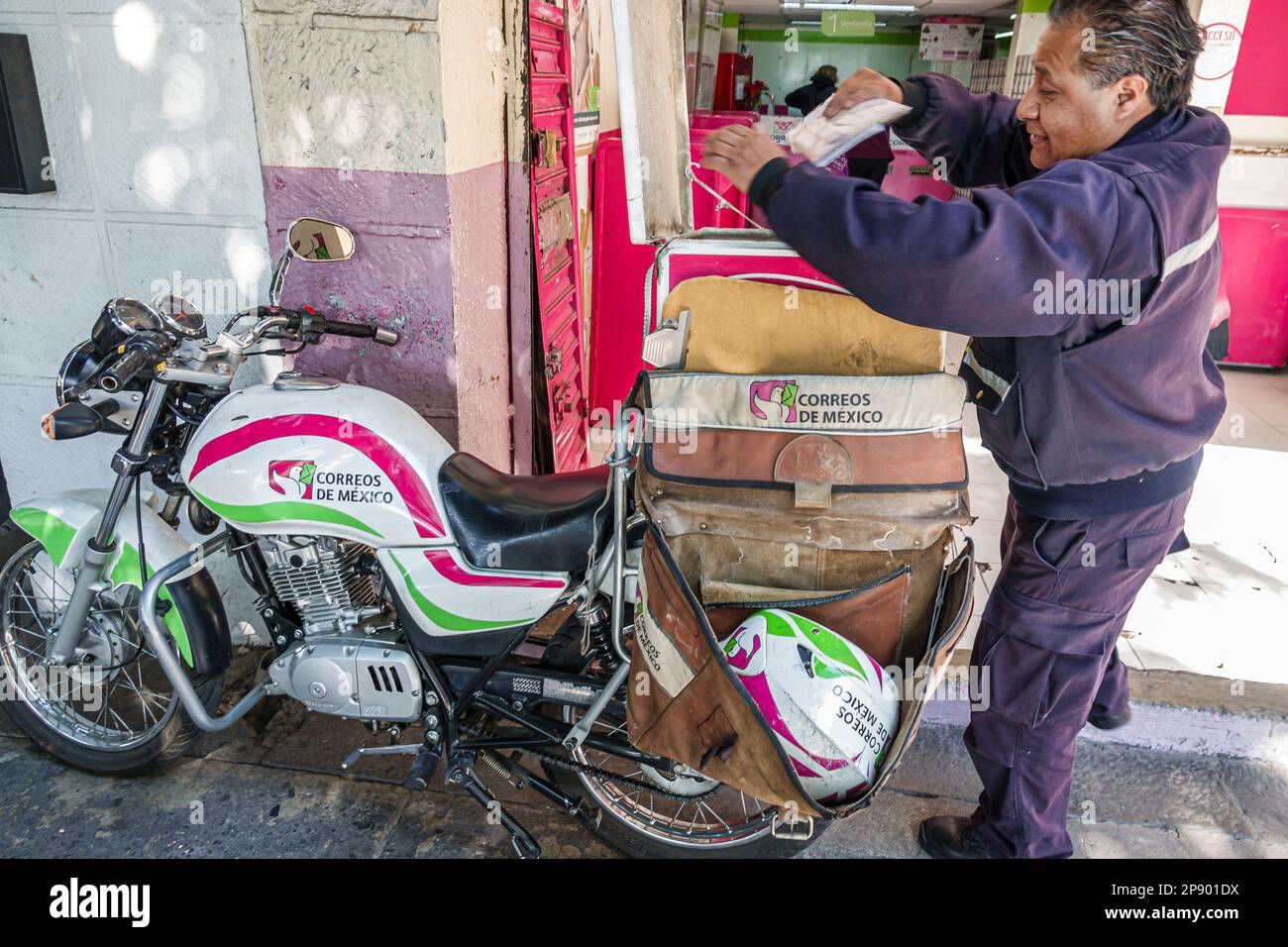 Mexico City,post office postal mail mailman motorcycle,man men male,adult adults,resident residents,employee employees worker workers,working work wor Stock Photo
