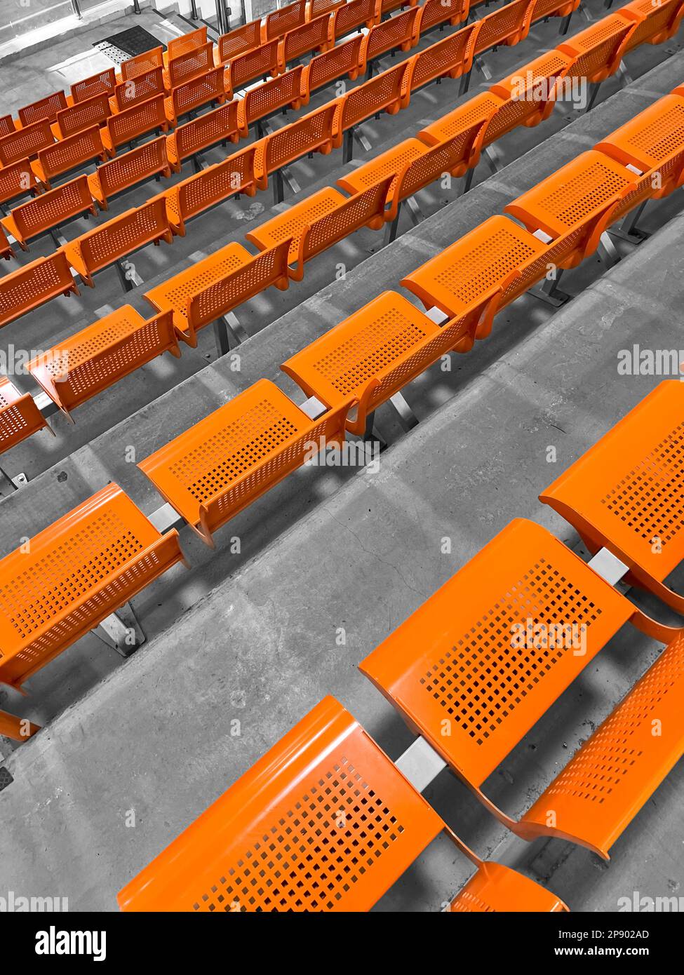View of orange seats in stadium Stock Photo - Alamy